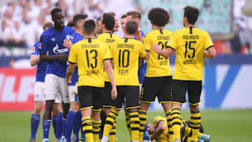 GELSENKIRCHEN, GERMANY - OCTOBER 26: FC Schalke 04 players and Borussia Dortmund players clash as Achraf Hakimi of Borussia Dortmund goes down injured during the Bundesliga match between FC Schalke 04 and Borussia Dortmund at Veltins-Arena on October 26, 2019 in Gelsenkirchen, Germany. (Photo by Alex Grimm/Bongarts/Getty Images)