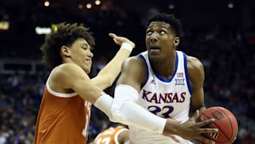 KANSAS CITY, MISSOURI - MARCH 14: David McCormack #33 of the Kansas Jayhawks shoots over Jaxson Hayes #10 of the Texas Longhorns during the quarterfinal game of the Big 12 Basketball Tournament at Sprint Center on March 14, 2019 in Kansas City, Missouri. (Photo by Jamie Squire/Getty Images)