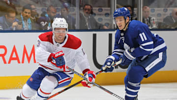 TORONTO, ON - OCTOBER 3: Max Domi #13 of the Montreal Canadiens skates with the puck against Zach Hyman #11 of the Toronto Maple Leafs during an NHL game at Scotiabank Arena on October 3, 2018 in Toronto, Ontario, Canada. The Maple Leafs defeated the Canadiens 3-2 in overtime. (Photo by Claus Andersen/Getty Images)