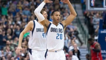 Mar 13, 2015; Dallas, TX, USA; Dallas Mavericks forward Dirk Nowitzki (41) and guard Devin Harris (20) fire up the crowd during the second half against the Los Angeles Clippers at the American Airlines Center. The Mavericks defeated the Clippers 129-99. Mandatory Credit: Jerome Miron-USA TODAY Sports