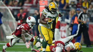 Dec 27, 2015; Glendale, AZ, USA; Green Bay Packers running back Eddie Lacy (27) breaks the tackle of Arizona Cardinals defensive back D.J. Swearinger (36) en route to a touchdown during the second half at University of Phoenix Stadium. The Cardinals won 38-8. Mandatory Credit: Joe Camporeale-USA TODAY Sports