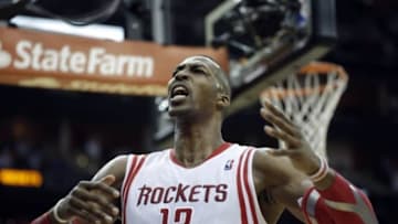 Apr 30, 2014; Houston, TX, USA; Houston Rockets center Dwight Howard (12) yells to the crowd after blocking a shot during the fourth quarter against the Portland Trail Blazers in game five of the first round of the 2014 NBA Playoffs at Toyota Center. Mandatory Credit: Andrew Richardson-USA TODAY Sports
