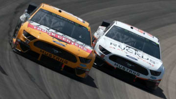 FORT WORTH, TX - MARCH 31: Clint Bowyer, driver of the #14 Rush Truck Centers/Cummins Ford, leads Daniel Suarez, driver of the #41 Ruckus Ford, during the Monster Energy NASCAR Cup Series O'Reilly Auto Parts 500 at Texas Motor Speedway on March 31, 2019 in Fort Worth, Texas. (Photo by Sean Gardner/Getty Images)