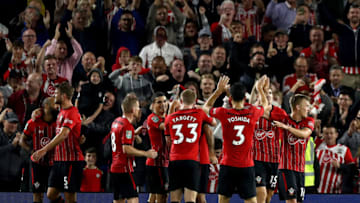 BRIGHTON, ENGLAND - AUGUST 28: Charlie Austin of Southampton celebrates with teammates after scoring his team's first goal during the Carabao Cup Second Round match between Brighton & Hove Albion and Southampton at American Express Community Stadium on August 28, 2018 in Brighton, England. (Photo by Bryn Lennon/Getty Images)
