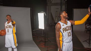 Sep 26, 2016; Indianapolis, IN, USA; Indiana Pacers forward C.J. Miles (0) poses for a photo while teammate forward Paul George (13) takes a picture with his phone during media day at Bankers Life Fieldhouse. Mandatory Credit: Trevor Ruszkowski-USA TODAY Sports