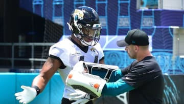 Jaguars first round draft pick (44) OLB Travon Walker works on technique with outside linebackers coach Bill Shuey Friday afternoon during Rookie Minicamp. The Jacksonville Jaguars held their first Rookie Minicamp on the turf of TIAA Bank Field Friday afternoon, May 13, 2022. Among those in attendance were the team's 2022 draft picks. [Bob Self/Florida Times-Union]Jki 051322 Jagsrookieminic 3