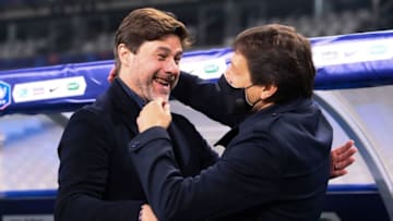 Paris Saint-Germain's Argentinian head coach Mauricio Pochettino (L) celebrates with Paris Saint-Germain's Brazilian sporting director Leonardo after winning the French Cup final football match between Paris Saint-Germain and Monaco at the Stade de France stadium, in Saint-Denis, on the outskirts of Paris, on May 19, 2021. (Photo by FRANCK FIFE / AFP) (Photo by FRANCK FIFE/AFP via Getty Images)