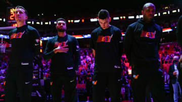 MIAMI, FLORIDA - NOVEMBER 17: (L-R) Duncan Robinson #55, Max Strus #31, Tyler Herro #14, and P.J. Tucker #17 of the Miami Heat stand during the National Anthem prior to the game against the New Orleans Pelicans at FTX Arena on November 17, 2021 in Miami, Florida. NOTE TO USER: User expressly acknowledges and agrees that, by downloading and or using this photograph, User is consenting to the terms and conditions of the Getty Images License Agreement. (Photo by Mark Brown/Getty Images)