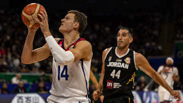 MANILA, PHILIPPINES - AUGUST 30: Walker Kessler #14 of USA drives to the basket against Ahmad Dwairi #44 of Jordan during the FIBA Basketball World Cup Group C game between United States and Jordan at Mall of Asia Arena on August 30, 2023 in Pasay, Metro Manila, Philippines. (Photo by Ezra Acayan/Getty Images)