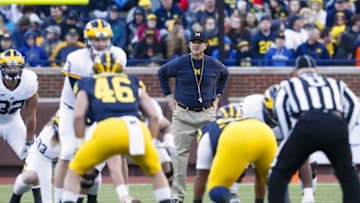 Apr 1, 2016; Ann Arbor, MI, USA; Michigan Wolverines head coach Jim Harbaugh looks on as quarterback Wilton Speight (3) gets set to run a play during the spring game at Michigan Stadium. Mandatory Credit: Rick Osentoski-USA TODAY Sports