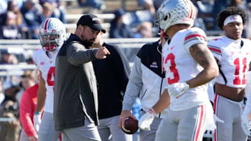 Oct 29, 2022; University Park, Pennsylvania, USA; Ohio State Buckeyes head coach Ryan Day points to safety Cameron Martinez (13) prior to the NCAA Division I football game against the Penn State Nittany Lions at Beaver Stadium. Mandatory Credit: Adam Cairns-The Columbus DispatchNcaa Football Ohio State Buckeyes At Penn State Nittany Lions