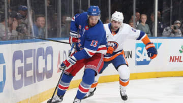 NEW YORK, NY - NOVEMBER 21: Kevin Hayes #13 of the New York Rangers skates with the puck against Nick Leddy #2 of the New York Islanders at Madison Square Garden on November 21, 2018 in New York City. The New York Rangers won 5-0. (Photo by Jared Silber/NHLI via Getty Images)