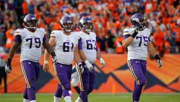 DENVER, CO - OCTOBER 04: Offensive guard Michael Harris #79, center Joe Berger #61, guard Brandon Fusco #63 and tackle Matt Kalil #75 of the Minnesota Vikings head for the bench as they face the Denver Broncos at Sports Authority Field at Mile High on October 4, 2015 in Denver, Colorado. The Broncos defeated the Vikings 23-20. (Photo by Doug Pensinger/Getty Images)