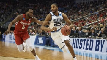 PITTSBURGH, PA - MARCH 15: Villanova Wildcats guard Mikal Bridges (25) tries to drive around Radford Highlanders guard Donald Hicks (5) during the second half of the first round of the NCAA Division I Men's Championships between the Villanova Wildcats and the Radford Highlanders at PPG Paints Arena in Pittsburgh, PA on March 15, 2018. (Photo by Shelley Lipton/Icon Sportswire via Getty Images)