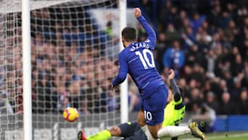 LONDON, ENGLAND - FEBRUARY 02: Eden Hazard of Chelsea scores his team's third goal past Karlan Grant of Huddersfield Town during the Premier League match between Chelsea FC and Huddersfield Town at Stamford Bridge on February 2, 2019 in London, United Kingdom. (Photo by Richard Heathcote/Getty Images)