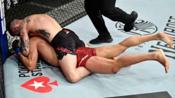 EDMONTON, ALBERTA - JULY 27: Gavin Tucker of Canada secures a rear choke submission against Seungwoo Choi of South Korea in their featherweight bout during the UFC 240 event at Rogers Place on July 27, 2019 in Edmonton, Alberta, Canada. (Photo by Jeff Bottari/Zuffa LLC/Zuffa LLC)