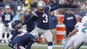 Dec 14, 2014; Foxborough, MA, USA; New England Patriots punter Ryan Allen (6) holds the ball for kicker Stephen Gostkowski (3) against the Miami Dolphins during the third quarter at Gillette Stadium. The Patriots won 41-13. Mandatory Credit: Stew Milne-USA TODAY Sports