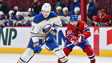 MONTREAL, QC - FEBRUARY 13: Tage Thompson #72 of the Buffalo Sabres skates the puck against Joel Armia #40 of the Montreal Canadiens during the second period at Centre Bell on February 13, 2022 in Montreal, Canada. (Photo by Minas Panagiotakis/Getty Images)
