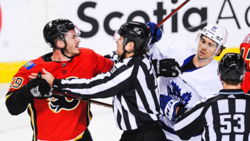 CALGARY, AB - JANUARY 24: Matthew Tkachuk #19 of the Calgary Flames shoves John Tavares #91 of the Toronto Maple Leafs after the whistle during an NHL game at Scotiabank Saddledome on January 24, 2021 in Calgary, Alberta, Canada. (Photo by Derek Leung/Getty Images)