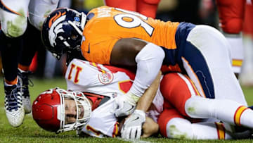 Nov 27, 2016; Denver, CO, USA; Kansas City Chiefs quarterback Alex Smith (11) is sacked by Denver Broncos outside linebacker DeMarcus Ware (94) in the fourth quarter at Sports Authority Field at Mile High. The Chiefs defeated the Broncos 30-27 in overtime. Mandatory Credit: Isaiah J. Downing-USA TODAY Sports