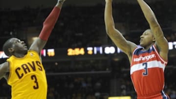 Oct 30, 2012; Cleveland, OH, USA; Washington Wizards shooting guard Bradley Beal (3, right) shoots over Cleveland Cavaliers shooting guard Dion Waiters (3, left) in the fourth quarter at Quicken Loans Arena. Mandatory Credit: David Richard-USA TODAY Sports