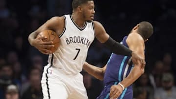 Feb 21, 2016; Brooklyn, NY, USA; Brooklyn Nets forward Joe Johnson (7) pushes Charlotte Hornets guard Nicolas Batum (5) in first half at Barclays Center. Mandatory Credit: William Hauser-USA TODAY Sports