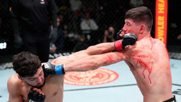 LAS VEGAS, NEVADA - FEBRUARY 26: (R-L) Joel Alvarez of Spain punches Arman Tsarukyan of Armenia in their lightweight fight during the UFC Fight Night event at UFC APEX on February 26, 2022 in Las Vegas, Nevada. (Photo by Chris Unger/Zuffa LLC)