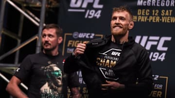 11 December 2015; Conor McGregor, right, and coach John Kavanagh, ahead of weighing in for his featherweight bout against Jose Aldo. UFC 194: Weigh-In, MGM Grand Garden Arena, Las Vegas, USA. Picture credit: Ramsey Cardy / SPORTSFILE (Photo by Sportsfile/Corbis via Getty Images)