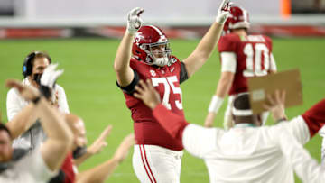 MIAMI GARDENS, FLORIDA - JANUARY 11: Tommy Brown #75 of the Alabama Crimson Tide signals for the fourth quarter during the College Football Playoff National Championship against the Alabama Crimson Tide at Hard Rock Stadium on January 11, 2021 in Miami Gardens, Florida. (Photo by Jamie Schwaberow/Getty Images)