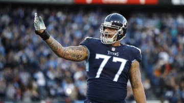 NASHVILLE, TN - DECEMBER 2: Taylor Lewan #77 of the Tennessee Titans jesters to the crowd after the Tennessee Titans scored a touchdown during the second quarter at Nissan Stadium on December 2, 2018 in Nashville, Tennessee. (Photo by Wesley Hitt/Getty Images)