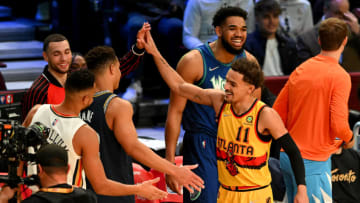 CLEVELAND, OHIO - FEBRUARY 19: Trae Young #11 of the Atlanta Hawks reacts with competitors during the 2022 NBA All-Star - MTN DEW 3-Point Contest as part of the 2022 All-Star Weekend at Rocket Mortgage Fieldhouse on February 19, 2022 in Cleveland, Ohio. NOTE TO USER: User expressly acknowledges and agrees that, by downloading and or using this photograph, User is consenting to the terms and conditions of the Getty Images License Agreement. (Photo by Jason Miller/Getty Images)