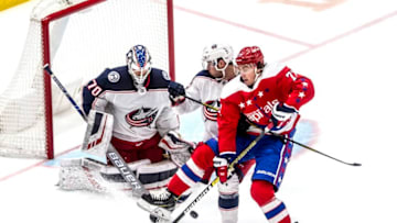 WASHINGTON, DC - DECEMBER 09: Columbus Blue Jackets Defenceman Ryan Murray (27) and Washington Capitals Right Wing T.J. Oshie (77) battle for the puck in front of Columbus Blue Jackets Goalie Joonas Korpisalo (70) during a NHL game between the Washington Capitals and the Columbus Blue Jackets on December 09, 2019, at Capital One Arena, in Washington D.C.(Photo by Tony Quinn/Icon Sportswire via Getty Images)