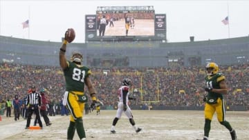 Dec 8, 2013; Green Bay, WI, USA; Green Bay Packers tight end Andrew Quarless (81) celebrates a touchdown catch during the fourth quarter against the Atlanta Falcons at Lambeau Field. Green Bay won 22-21. Mandatory Credit: Jeff Hanisch-USA TODAY Sports