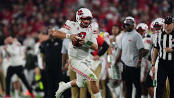 Jan 1, 2022; Pasadena, CA, USA; Utah Utes quarterback Cameron Rising (7) runs against the Ohio State Buckeyes in the second half during the 2022 Rose Bowl college football game at the Rose Bowl. Mandatory Credit: Gary A. Vasquez-USA TODAY Sports