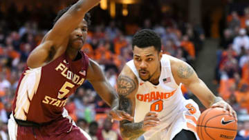 SYRACUSE, NY - FEBRUARY 11: Michael Gbinije #0 of the Syracuse Orange drives to the basket against the defense of Malik Beasley #5 of the Florida State Seminoles during the second half at the Carrier Dome on February 11, 2016 in Syracuse, New York. Syracuse won 85-72. (Photo by Rich Barnes/Getty Images)