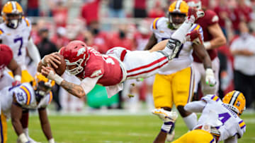 FAYETTEVILLE, AR - NOVEMBER 21: Feleipe Franks #13 of the Arkansas Razorbacks dives into the end zone for a touchdown in the first half of a game against the LSU Tigers at Razorback Stadium on November 21, 2020 in Fayetteville, Arkansas. (Photo by Wesley Hitt/Getty Images)