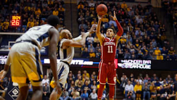 MORGANTOWN, WV - JANUARY 06: Trae Young #11 of the Oklahoma Sooners pulls up for three against the West Virginia Mountaineers at the WVU Coliseum on January 6, 2018 in Morgantown, West Virginia. (Photo by Justin K. Aller/Getty Images)