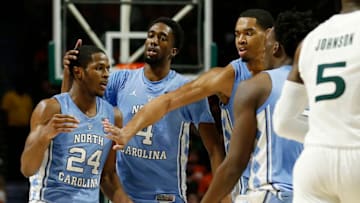 MIAMI, FLORIDA - JANUARY 19: Kenny Williams #24 of the North Carolina Tar Heels celebrates with teammates against the Miami Hurricanes during the second half at Watsco Center on January 19, 2019 in Miami, Florida. (Photo by Michael Reaves/Getty Images)