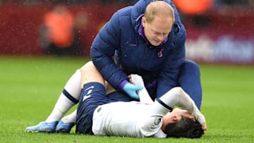 Tottenham Hotspur's South Korean striker Son Heung-Min holds his arm as he lies injured on the pitch during the English Premier League football match between Aston Villa and Tottenham Hotspur at Villa Park in Birmingham, central England on February 16, 2020. - Korean star Son Heung-min has fractured his right arm his club Tottenham Hotspur said on Tuesday, delivering a blow to their hopes of silverware this season and qualifying for the Champions League next season. (Photo by Justin TALLIS / AFP) / RESTRICTED TO EDITORIAL USE. No use with unauthorized audio, video, data, fixture lists, club/league logos or 'live' services. Online in-match use limited to 120 images. An additional 40 images may be used in extra time. No video emulation. Social media in-match use limited to 120 images. An additional 40 images may be used in extra time. No use in betting publications, games or single club/league/player publications. / (Photo by JUSTIN TALLIS/AFP via Getty Images)