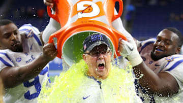 DETROIT, MI - DECEMBER 26: Head coach David Cutcliffe of the Duke Blue Devils reacts to his Gatorade bath by Mike Ramsay #99 and Trevon McSwain #95 after defeating the Northern Illinois Huskies 36-14 in the Quick Lane Bowl at Ford Field on December 26, 2017 in Detroit Michigan. (Photo by Gregory Shamus/Getty Images)