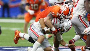 Jan 1, 2021; New Orleans, LA, USA; Clemson Tigers defensive lineman Bryan Bresee (11) sacks Ohio State Buckeyes quarterback Justin Fields (1) during the second half at Mercedes-Benz Superdome. Mandatory Credit: Chuck Cook-USA TODAY Sports