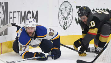 LAS VEGAS, NEVADA - FEBRUARY 13: Alex Pietrangelo #27 of the St. Louis Blues and Chandler Stephenson #20 of the Vegas Golden Knights go after the puck in the second period of their game at T-Mobile Arena on February 13, 2020 in Las Vegas, Nevada. The Golden Knights defeated the Blues 6-5 in overtime. (Photo by Ethan Miller/Getty Images)