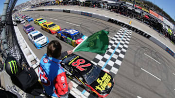 MARTINSVILLE, VA - MARCH 26: Martin Truex Jr., driver of the #78 5-hour ENERGY/Bass Pro Shops Toyota, and Kyle Busch, driver of the #18 M&M's Caramel Toyota, lead the field to the green flag to start the weather delayed Monster Energy NASCAR Cup Series STP 500 at Martinsville Speedway on March 26, 2018 in Martinsville, Virginia. (Photo by Jerry Markland/Getty Images)