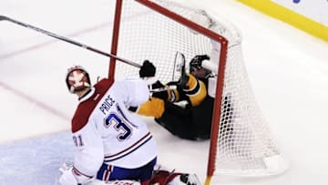 Oct 22, 2016; Boston, MA, USA; Montreal Canadiens goalie Carey Price (31) watches Boston Bruins left wing Brad Marchand (63) slide into the goal during the third period at TD Garden. Mandatory Credit: Bob DeChiara-USA TODAY Sports