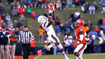 Nov 12, 2016; Charlottesville, VA, USA; Miami Hurricanes wide receiver Stacy Coley (3) leaps to catch the ball in front of Virginia Cavaliers defensive back Chris Moore (39) in the second quarter at Scott Stadium. The Hurricanes won 34-14. Mandatory Credit: Geoff Burke-USA TODAY Sports