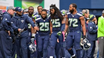 Oct 16, 2016; Seattle, WA, USA; Seattle Seahawks free safety Earl Thomas (29) and cornerback Richard Sherman (25) and defensive end Michael Bennett (72) on the sideline after surrendering a touchdown to the Atlanta Falcons during a NFL football game at CenturyLink Field. Mandatory Credit: Kirby Lee-USA TODAY Sports