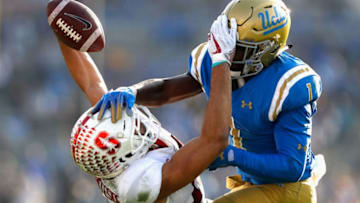 PASADENA, CA - NOVEMBER 24: Darnay Holmes #1 of the UCLA Bruins breaks up a pass play intended for JJ Arcega-Whiteside #19 of the Stanford Cardinal during the second half of a game at the Rose Bowl on November 24, 2018 in Pasadena, California. (Photo by Sean M. Haffey/Getty Images)