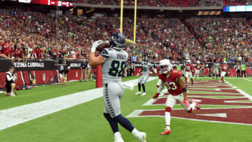 GLENDALE, ARIZONA - SEPTEMBER 29: Will Dissly #88 of the Seattle Seahawks catches a first half touchdown from Russell Wilson #3 while being defended by Byron Murphy Jr #33 of the Arizona Cardinals at State Farm Stadium on September 29, 2019 in Glendale, Arizona. (Photo by Norm Hall/Getty Images)
