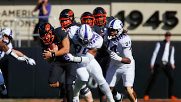 STILLWATER, OK - NOVEMBER 2: Defensive tackle Ross Blacklock #90 of the TCU Horned Frogs tackles quarterback Spencer Sanders #3 of the Oklahoma State Cowboys after three yards in the first quarter on November 2, 2019 at Boone Pickens Stadium in Stillwater, Oklahoma. OSU won 34-27. (Photo by Brian Bahr/Getty Images)
