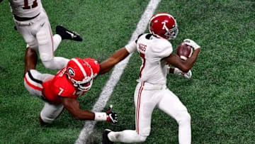 ATLANTA, GA - JANUARY 08: Trevon Diggs #7 of the Alabama Crimson Tide breaks the tackle of Lorenzo Carter #7 of the Georgia Bulldogs in the CFP National Championship presented by AT&T at Mercedes-Benz Stadium on January 8, 2018 in Atlanta, Georgia. (Photo by Scott Cunningham/Getty Images)